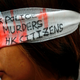 A protester covers her eye with gauze during a protest at Hong Kong International Airport, Aug. 12, 2019.